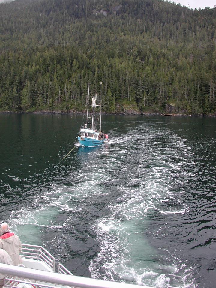 Rope attached, starting to tow boat away from the shore