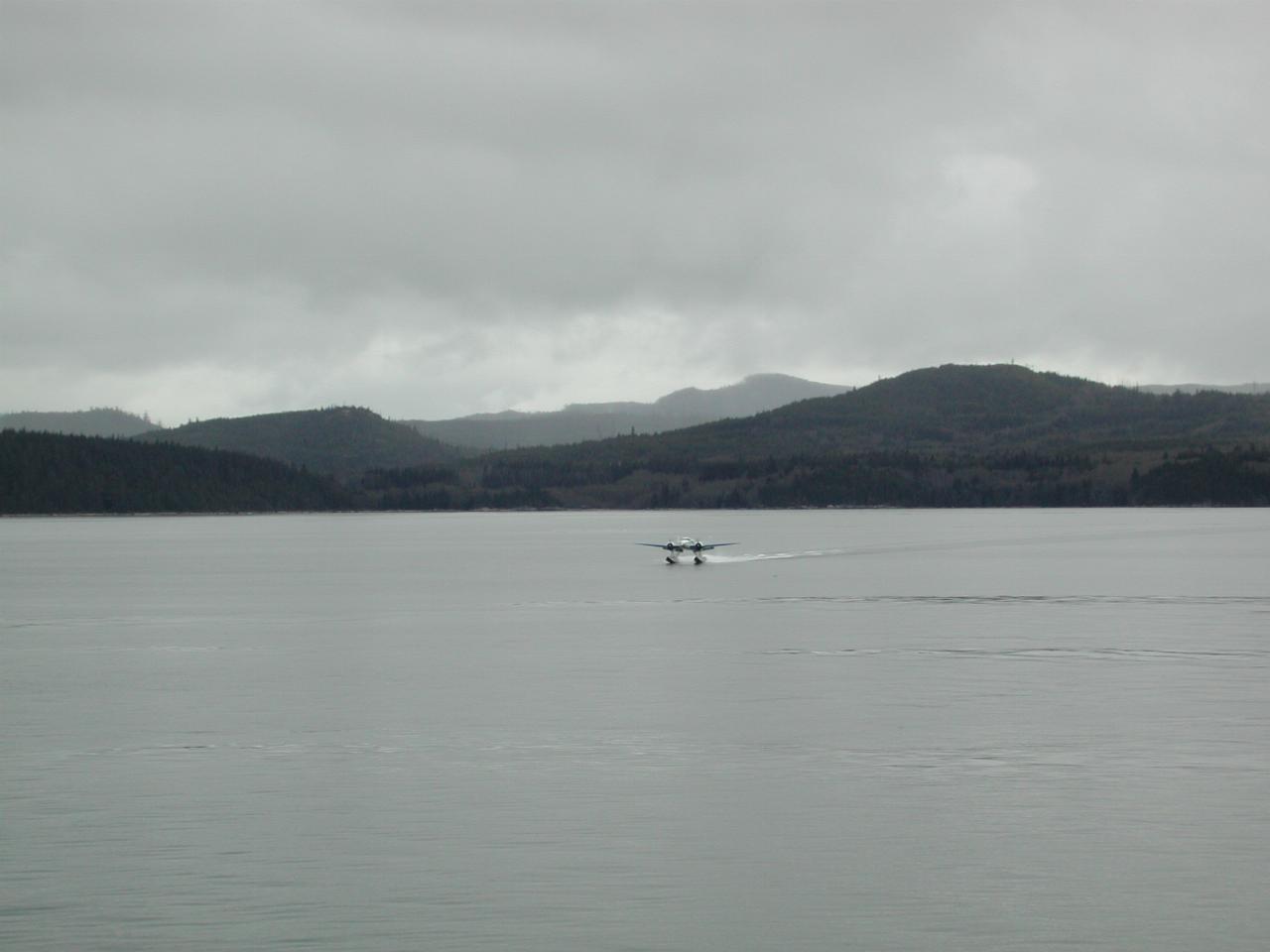 The float plane with the parts to fix the disabled boat's fuel pump