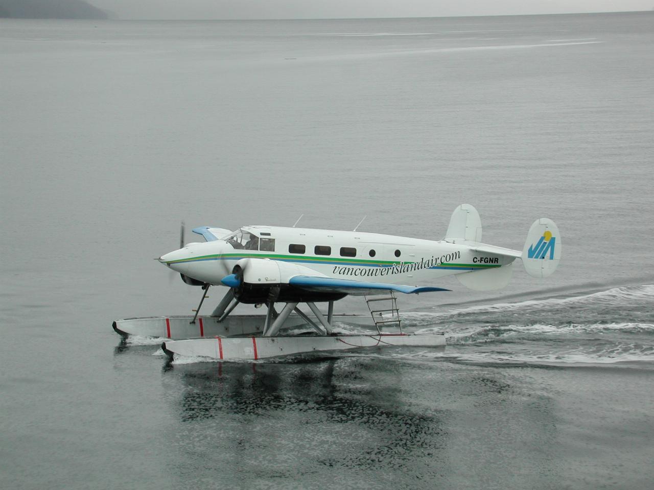 The float plane with the parts to fix the disabled boat's fuel pump