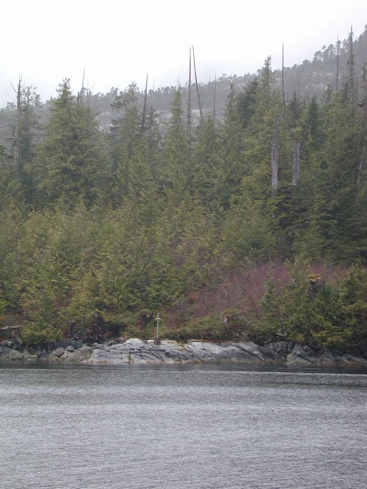 Cross by the sea just north of Klemtu, Swindle Island, BC