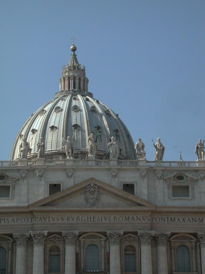 Close up of dome and sculptures on front of St. Peter's Basilica