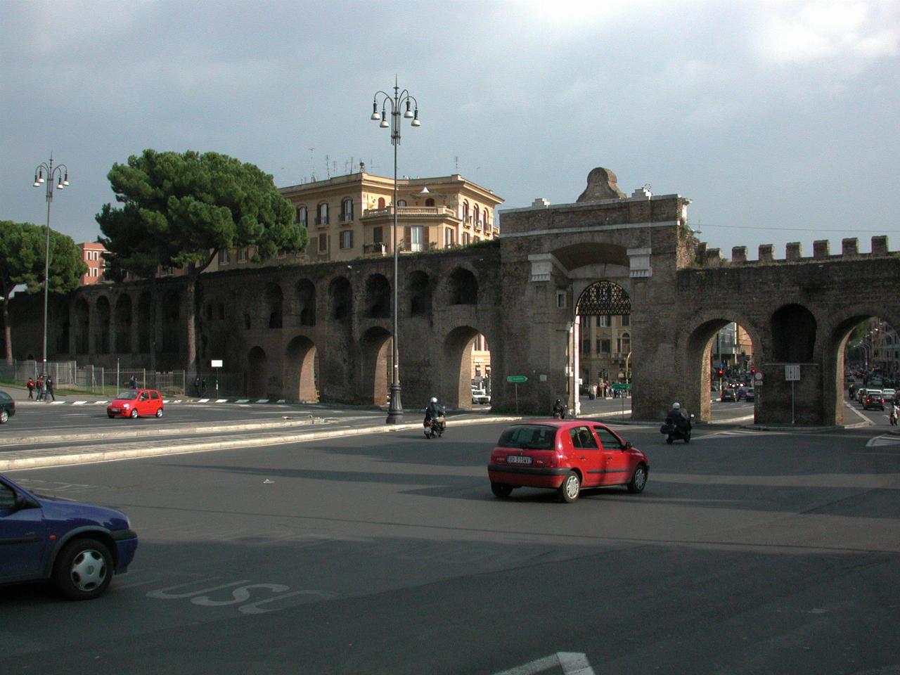 Via Appia Nuova passing out of the old Roman walls