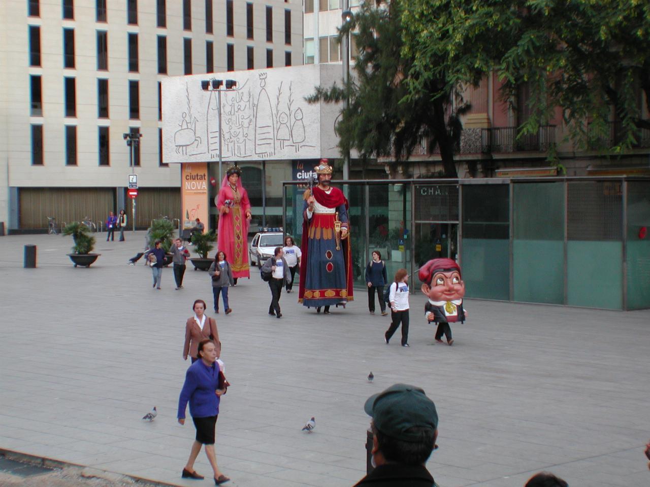 Characters arriving for St. Pilar feast day; building in background decoration by Picasso