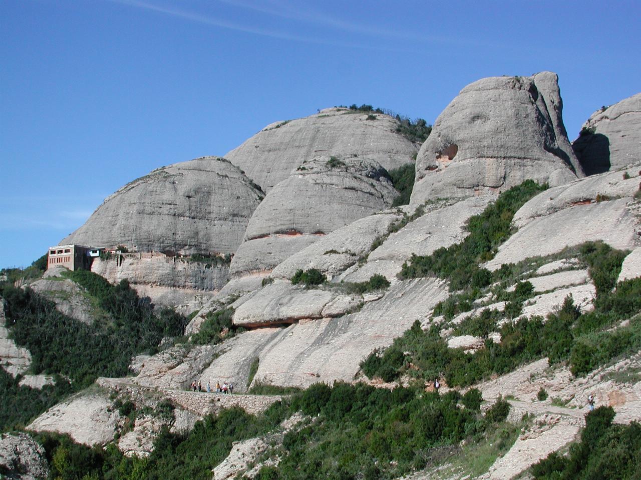 St. Joan chapel, walkers and the mountain at Montserrat