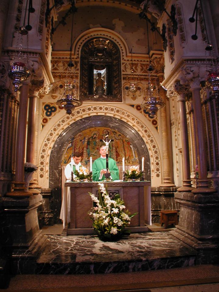 Mass in chapel at rear of main church, behind statue of the Black Madonna
