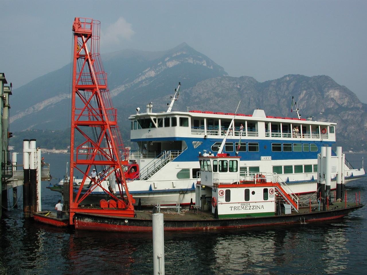 Car and passenger ferry arriving at Bellagio dock on Lake Como