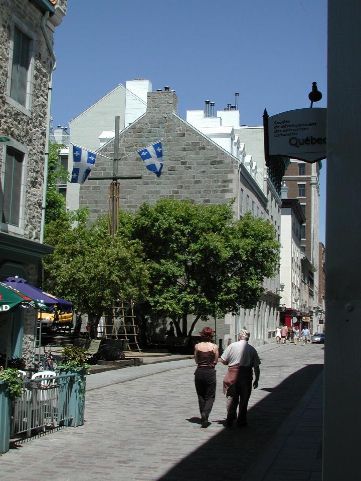 Street in lower town, Old Quebec, showing Quebec flag and traditional buildings