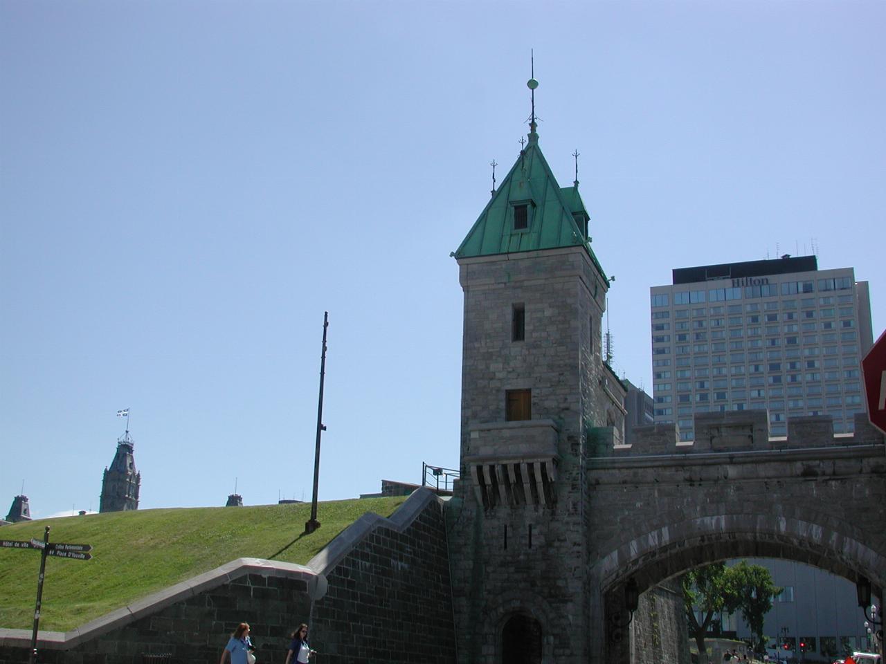 Gate in old city walls, with newer building outside