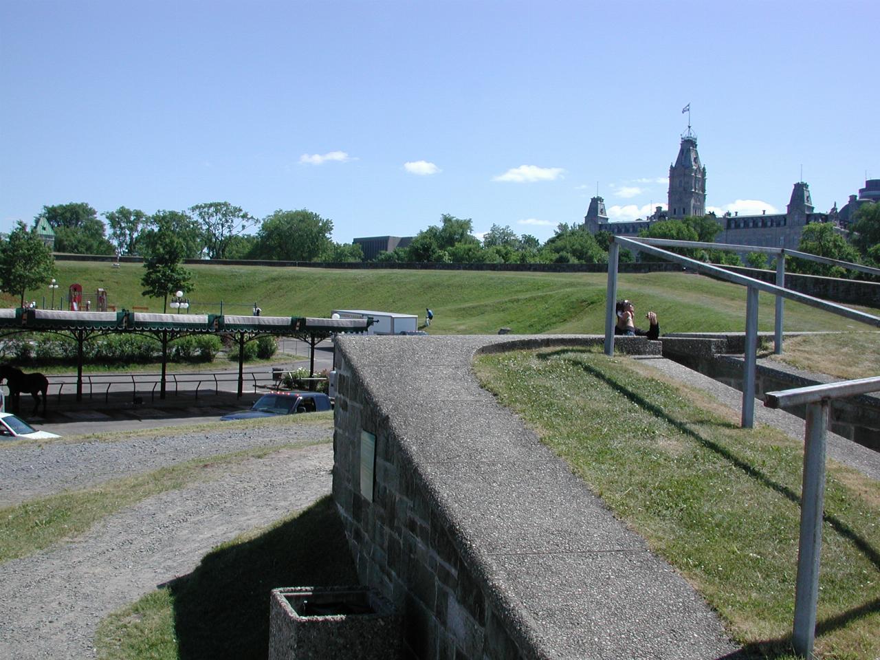 View along old city walls, showing horse carriage 