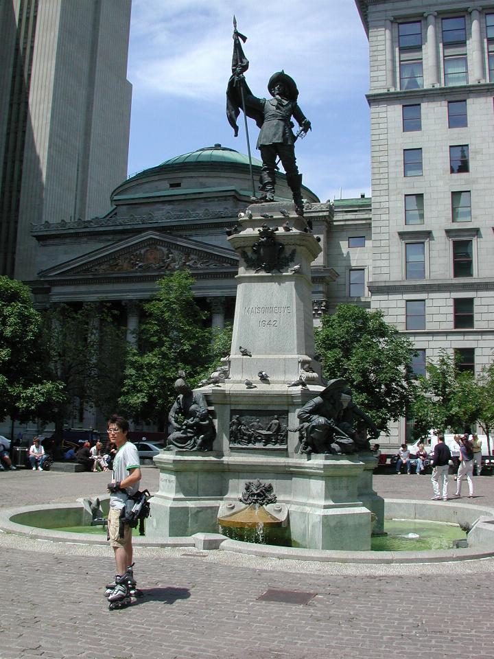 Statue of Maisonneuve in front of Basilica of Notre Dame; stock exchange building behind