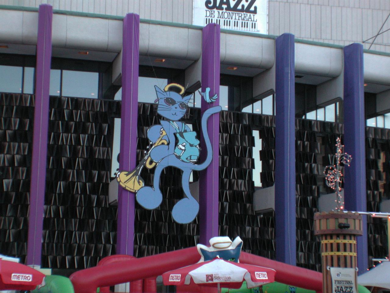 Main theatre at Place des Arts, featuring the Festival mascot 