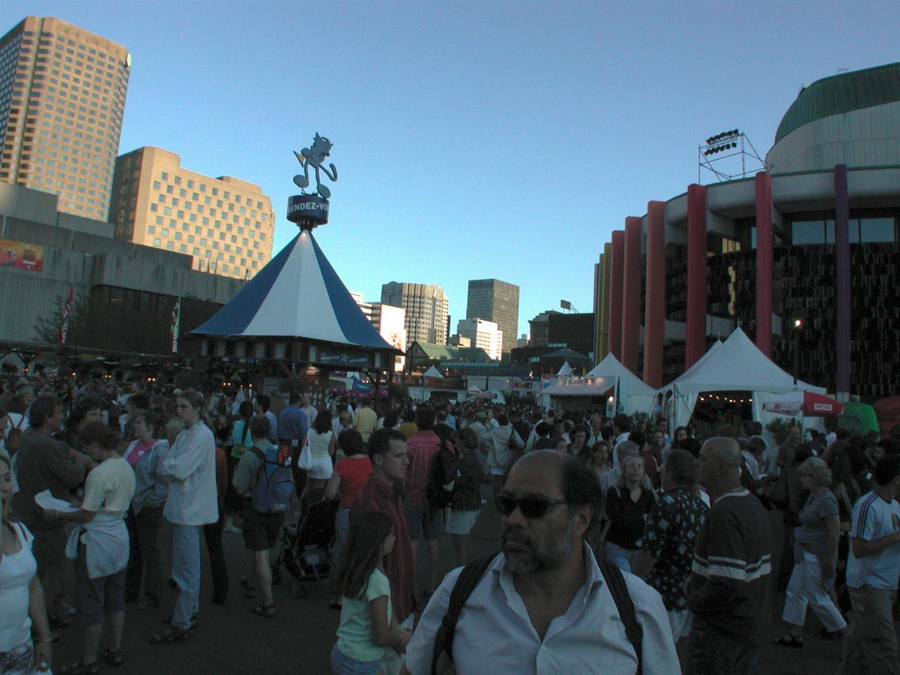 Crowd at Place des Arts, with Montreal buildings filling in the skyline