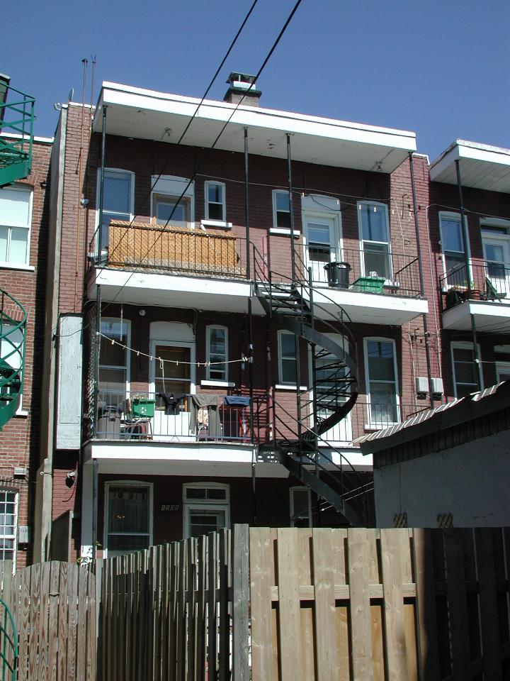 Rear of suburban Montreal home, one of the entry on second floor type