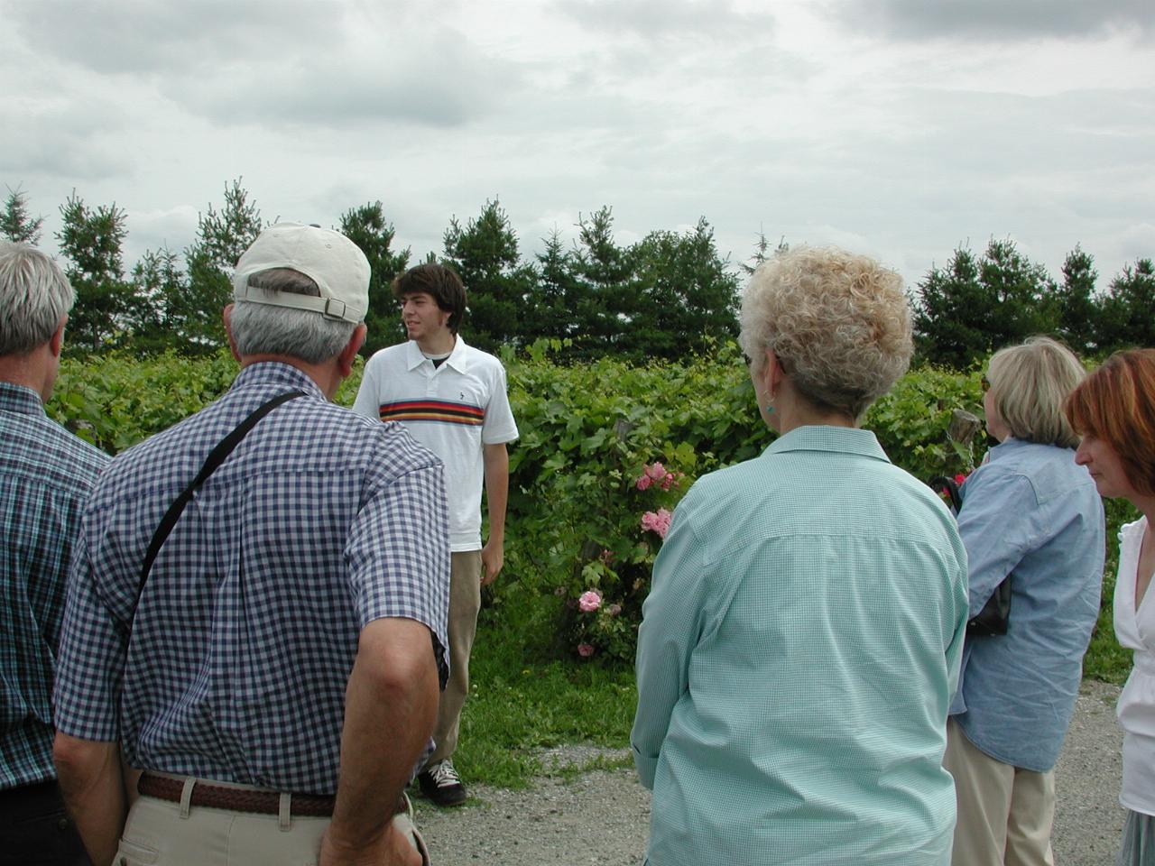 Winery guide talking to KPLU Tour group about vine growing in the region