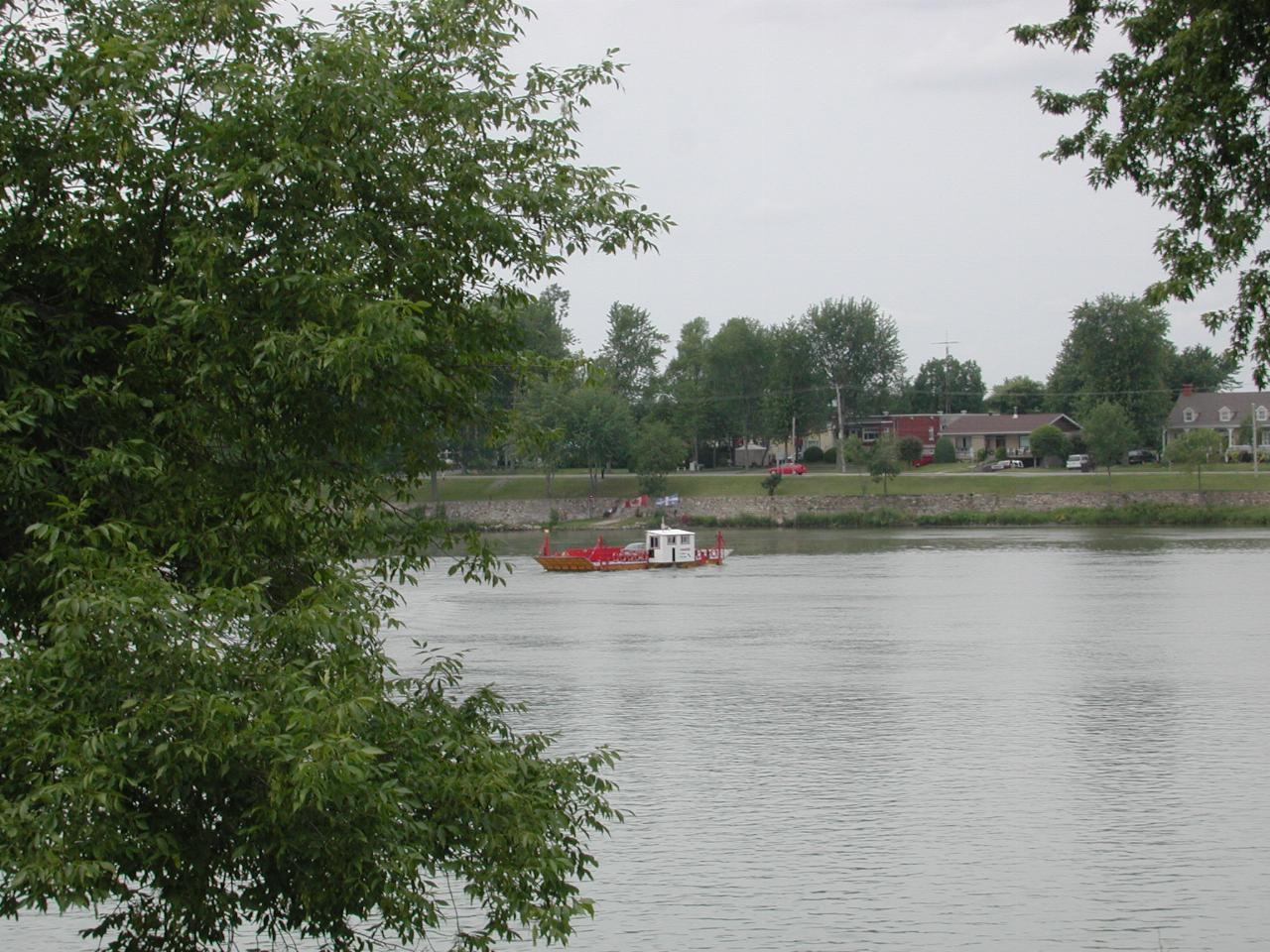 View of ferry crossing Richelieu River from Auberge St. Denis where we had lunch on the terrace