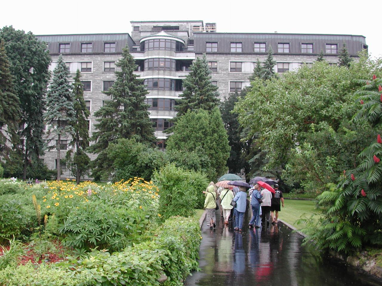 KPLU Tour group at garden of Hotel-Dieu de Montreal, on way to chapel, with hospital in background