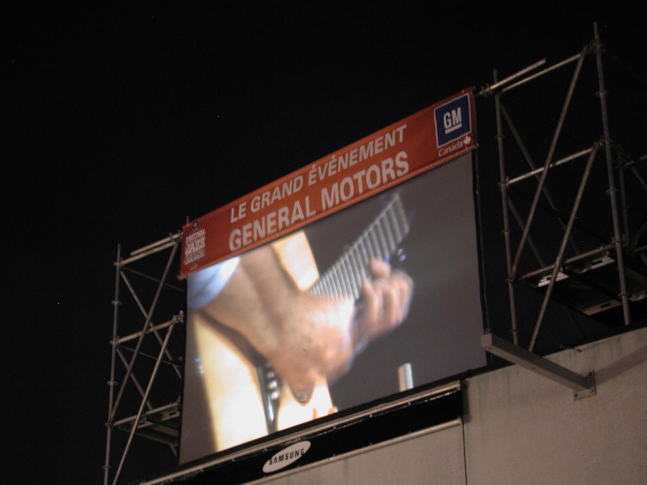 TV screen showing Main Stage performance: final concert by Pat Metheney