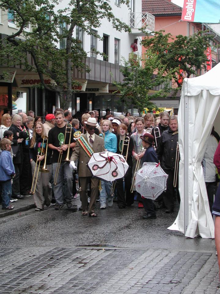 KPLU Viking Jazz: Main street of Molde with the New Orleans style marching band coming along