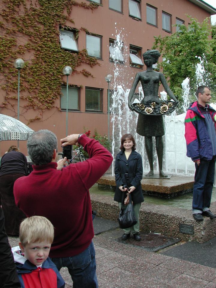 KPLU Viking Jazz: Joey, photographing Signe in front of The Rose Maiden statue at Molde Town Hall