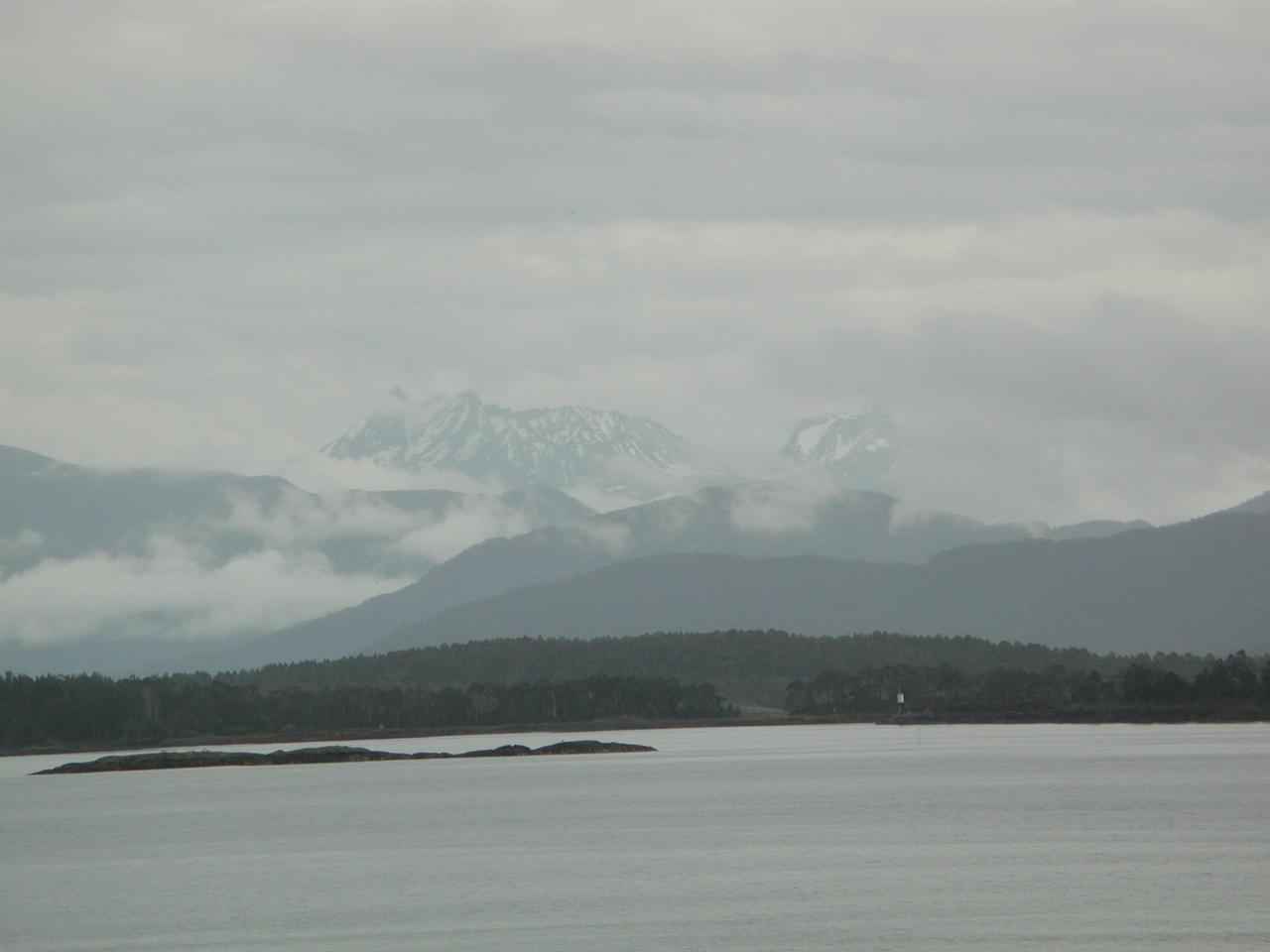 KPLU Viking Jazz: Snow covered mountains, in cloud, across the fjord