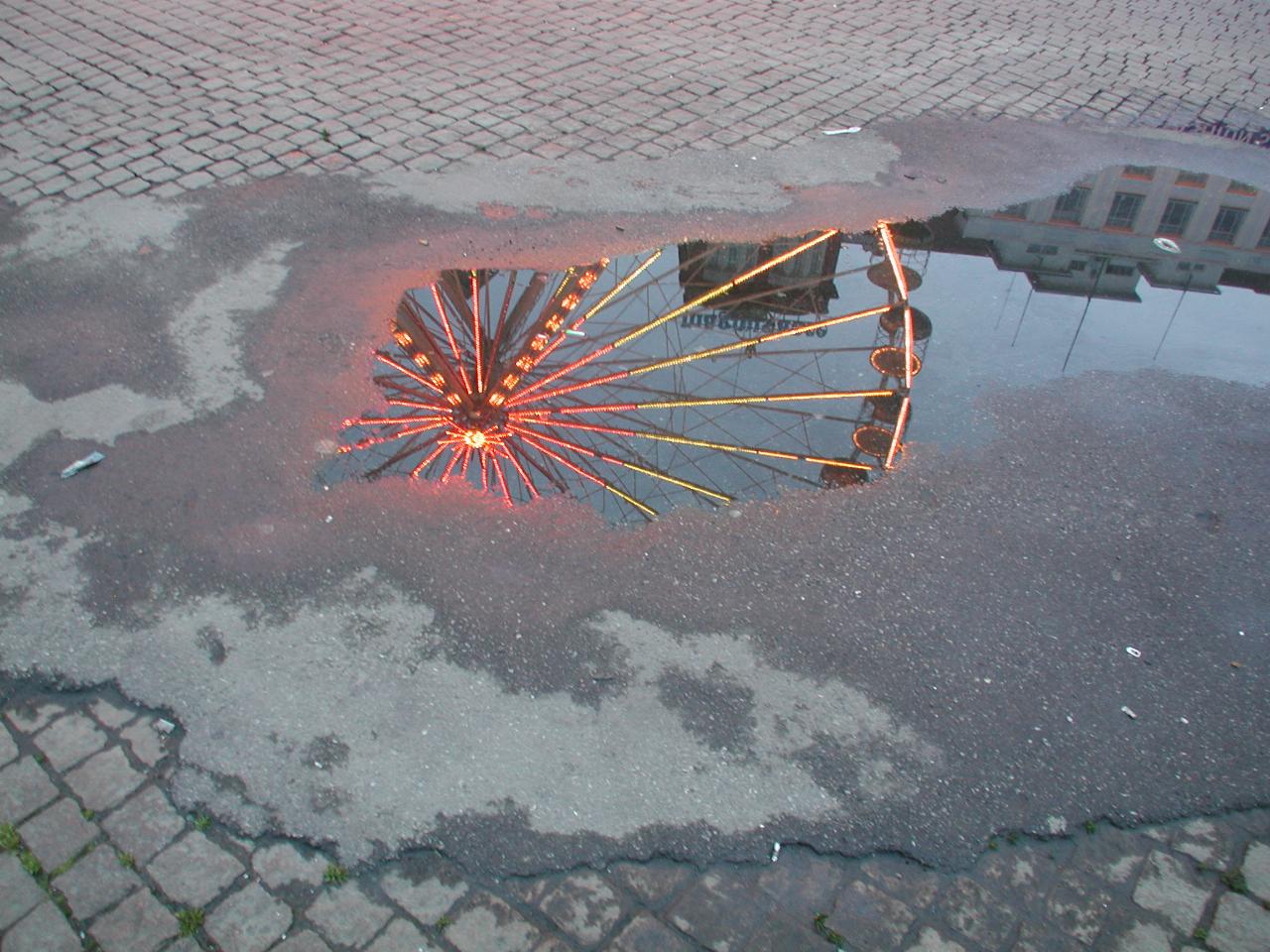 KPLU Viking Jazz: Reflection of ferris wheel in puddle, Bergen