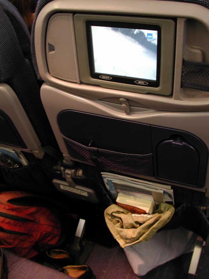 KPLU Viking Jazz: Seat back, with TV display showing view underneath the plane