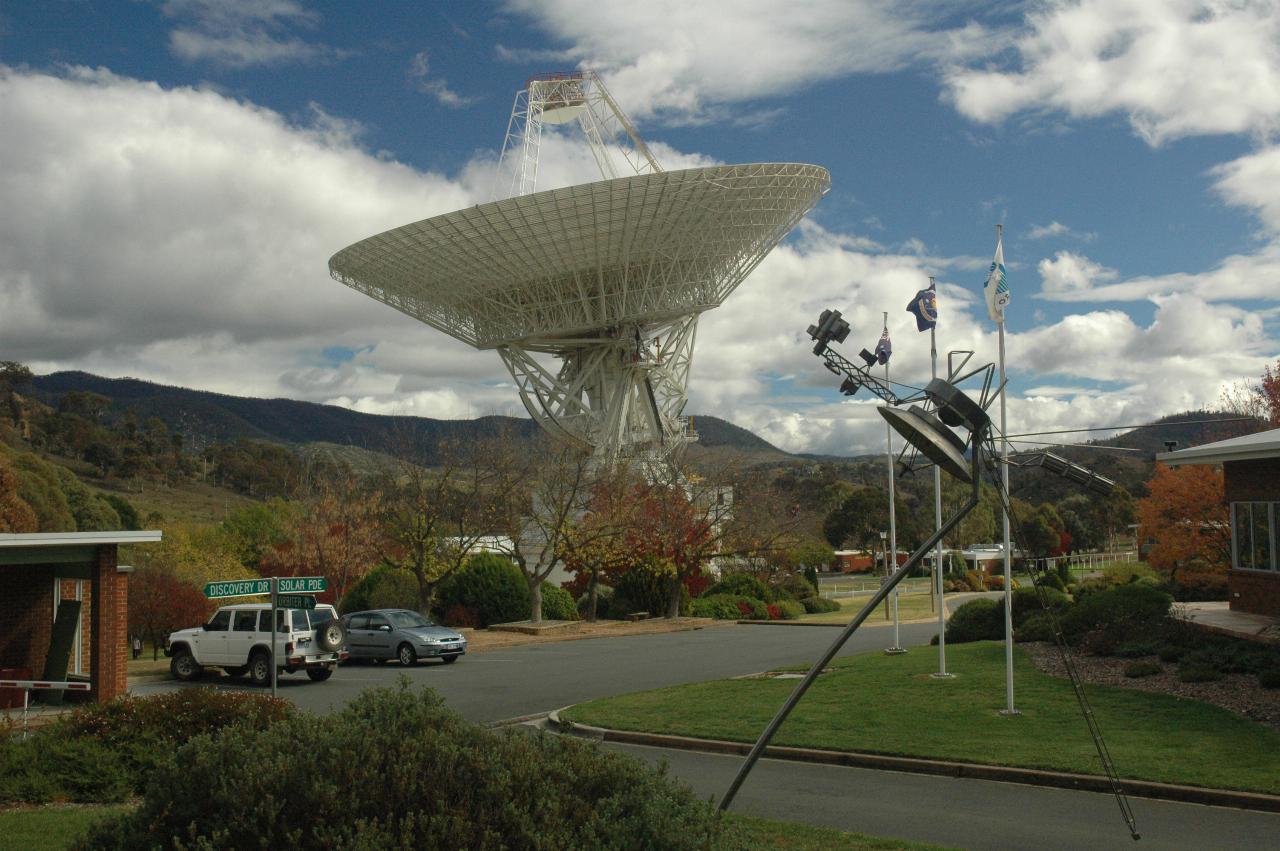 Another tracking dish pointing up, with sculpture of Voyager 2 in foreground