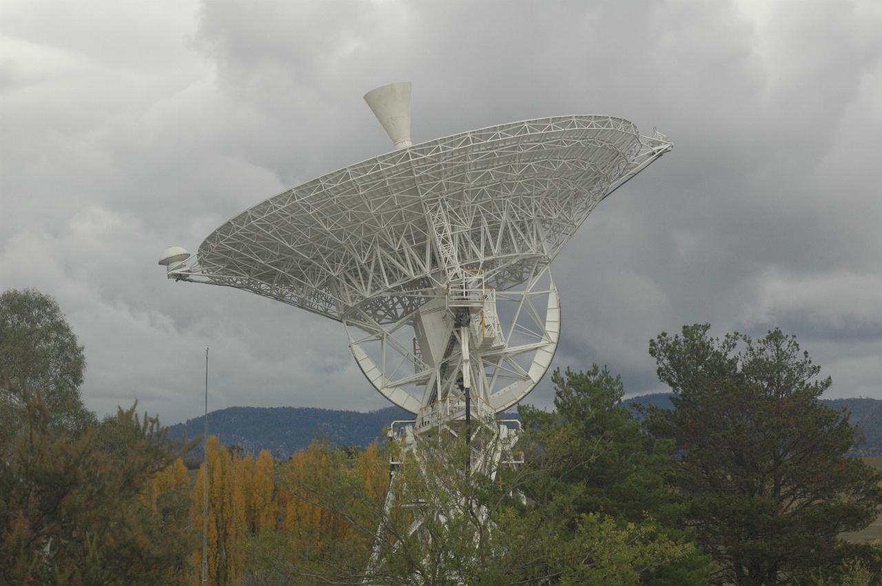 Side on view of first large tracking dish; autumn foliage in background