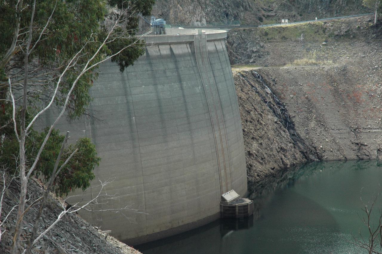 Upstream view of dam wall with nearly empty dam